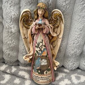 Roman Inc. Angel holding bluebird To Everything there is a season